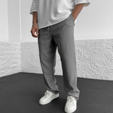 Pantalon Texturé à Rayures Verticales Coupe Ample