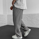 Pantalon Texturé à Rayures Verticales Coupe Ample