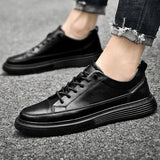 Baskets basses homme à lacets et panneaux surpiqués